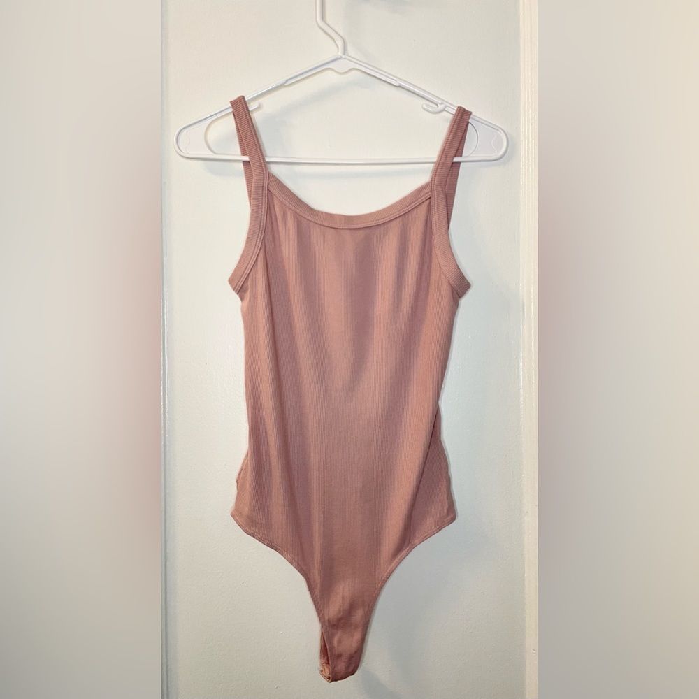 Cotton Citizen size S pink bodysuit. Scoop back, minimal coverage. Never worn!